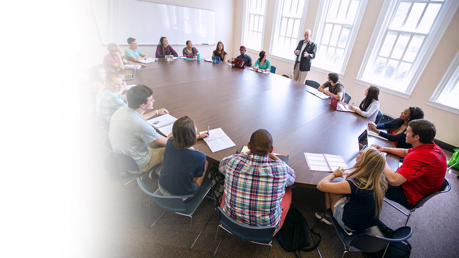 Students and Professor at a large round table.